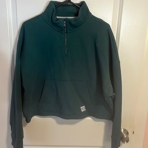 Under Armour dark green cropped half zip. Size medium.